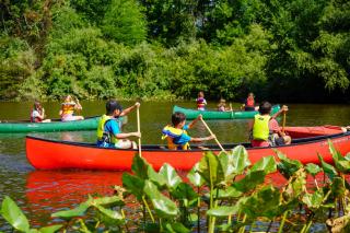 EEC Summer Camp Canoeing on the Pond multiple canoes in the pond