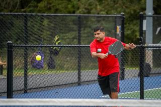 Pickleball Tournament Action Shot Red Shirt just Hit Ball