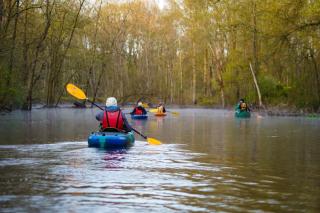 Sunrise Paddle Kayaking on the Passaic River group floating down river