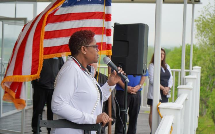 Commissioner Director and Air Force Veteran Shanel Y. Robinson sings the National Anthem at Neshanic Valley Golf Course 